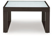 Ashley Furniture Beachloft outdoor cocktail table with a weather-resistant wooden top and sturdy metal frame.