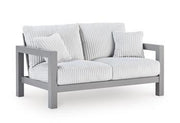 Outdoor table set from Ashley Furniture with a sturdy table and matching chairs, perfect for patio or garden use.