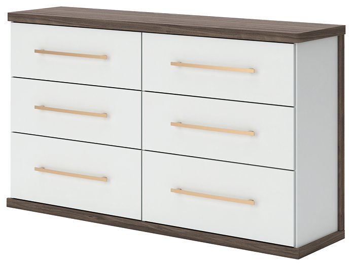 Ashley Furniture Kendanport Dresser with sleek wood finish, featuring multiple drawers and modern design, shown from an angled side view.