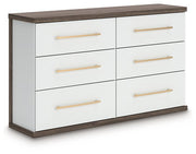 Ashley Furniture Kendanport Dresser in dark wood finish, angled view showing multiple drawers and sleek design.