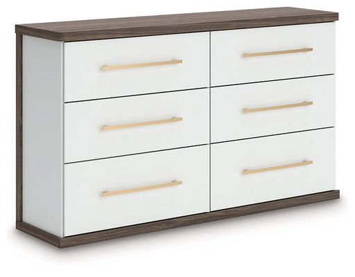 Ashley Furniture Kendanport Dresser in dark wood finish, angled view showing multiple drawers and sleek design.