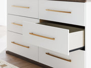 Ashley Furniture Kendanport dresser with sleek wood finish and modern hardware, featuring multiple drawers for storage.