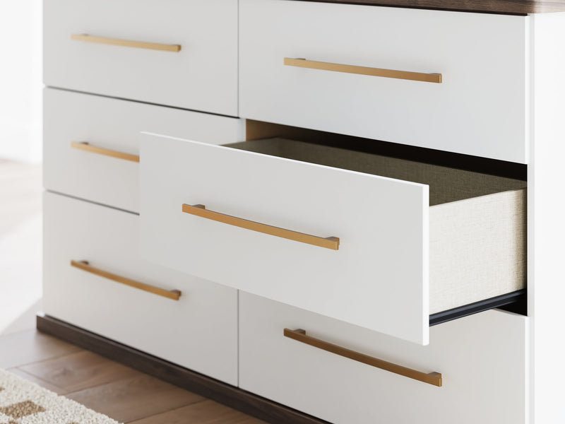Ashley Furniture Kendanport dresser with sleek wood finish and modern hardware, featuring multiple drawers for storage.