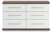 Ashley Furniture Kendanport Dresser with multiple drawers, finished in warm wood tone, shown in a head-on view.