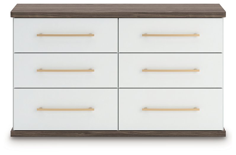 Ashley Furniture Kendanport Dresser with multiple drawers, finished in warm wood tone, shown in a head-on view.