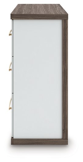 Ashley Furniture Kendanport Dresser with multiple drawers and a dark wood finish, shown from a side angle.