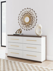 Ashley Furniture Kendanport Dresser with multiple drawers and a dark wood finish, shown in a well-lit bedroom setting.