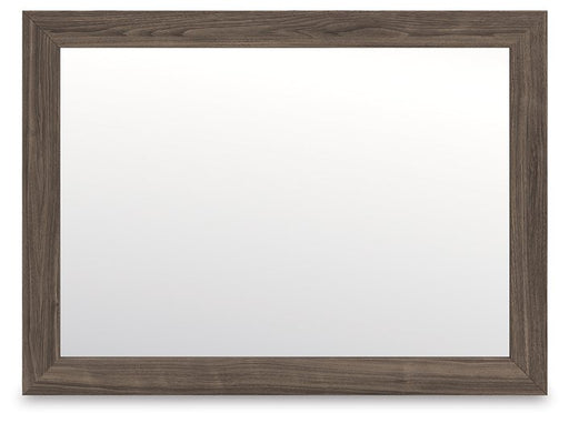 Ashley Furniture Kendanport bedroom mirror with a sleek rectangular design and a polished wooden frame.