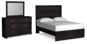 Ashley Furniture Belachime bedroom set with a bed frame, nightstands, and dresser in a modern, elegant bedroom design.