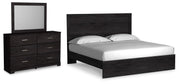 Ashley Furniture Belachime bedroom set including bed frame, nightstands, and dresser in a stylish, modern bedroom design.