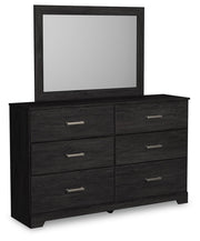 Ashley Furniture Belachime bedroom set with a stylish bed frame, nightstands, and dresser in a modern bedroom scene.