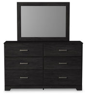 Ashley Furniture Belachime bedroom set featuring a headboard, nightstands, and matching bedroom furniture in a stylish design.