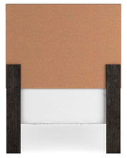 Ashley Furniture Belachime bedroom set with a modern bed frame, nightstands, and matching dresser in a stylish bedroom setting.