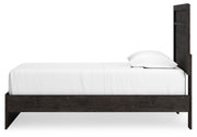 Ashley Furniture Belachime bedroom set featuring a bed, nightstands, and dresser with modern design and warm wood finish.