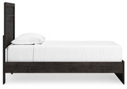 Ashley Furniture Belachime bedroom set featuring a wooden bed frame, matching nightstands, and a coordinated dresser.