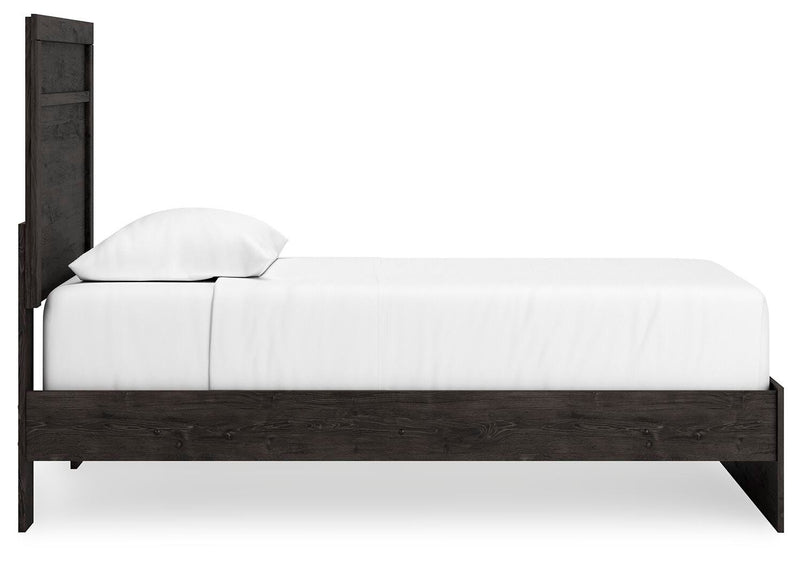 Ashley Furniture Belachime bedroom set featuring a wooden bed frame, matching nightstands, and a coordinated dresser.