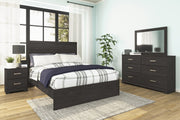 Ashley Furniture Belachime bedroom set with a modern bed frame, matching nightstands, and a coordinated dresser in a stylish bedroom.