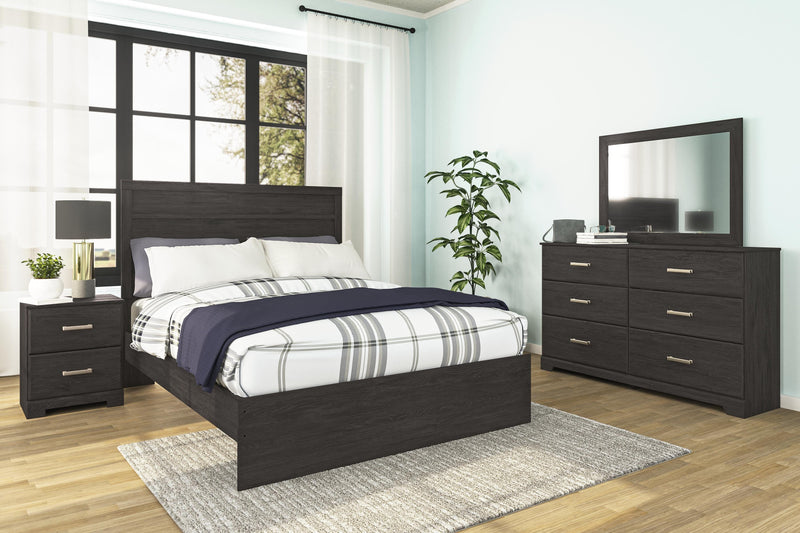 Ashley Furniture Belachime bedroom set with a modern bed frame, matching nightstands, and a coordinated dresser in a stylish bedroom.