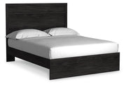 Ashley Furniture Belachime bedroom set featuring a bed, nightstands, and matching dresser with a modern design.