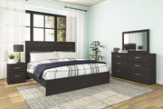 Ashley Furniture Belachime bedroom set with a modern bed frame, matching nightstands, and dresser in a stylish bedroom setup.