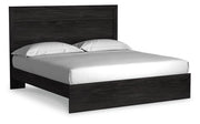 Ashley Furniture Belachime bedroom set with a bed, nightstands, and dresser shown from an angled view in a modern bedroom scene.