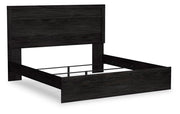 Ashley Furniture Belachime bedroom set with a modern bed frame and matching nightstands, shown from an angled view.
