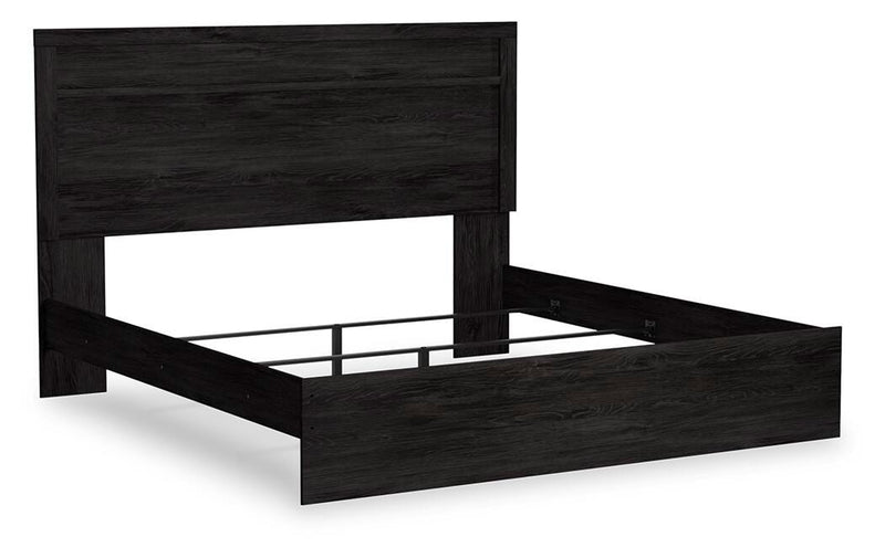 Ashley Furniture Belachime bedroom set with a modern bed frame and matching nightstands, shown from an angled view.