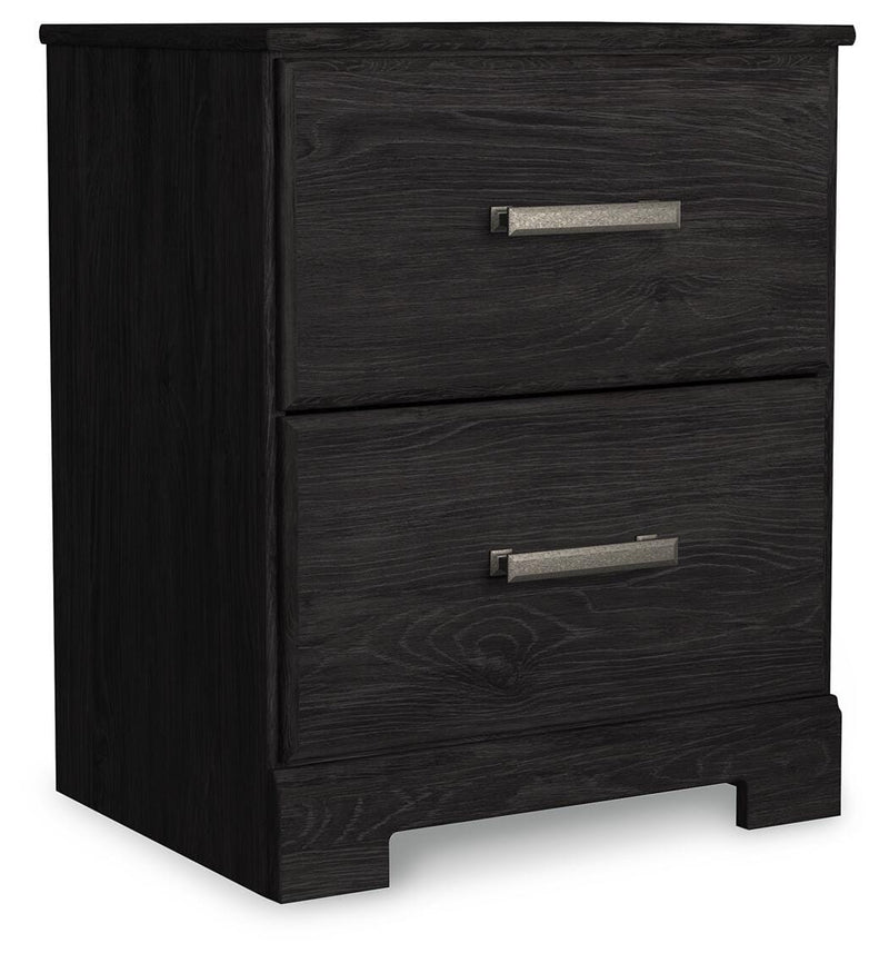Ashley Furniture Belachime bedroom set with a stylish bed frame, nightstands, and dresser in a cozy, modern bedroom setting.