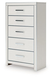 Ashley Furniture Zuraleus chest of drawers showing a sleek wooden design with multiple drawers and angled view.