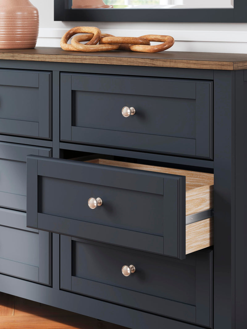Ashley Furniture Landocken Bedroom Set with bed frame, dresser, and nightstands in a modern bedroom design.