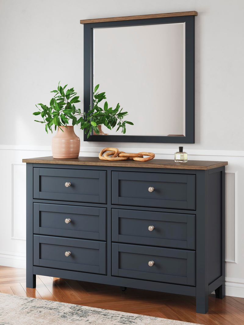 Ashley Furniture Landocken bedroom set featuring a bed, nightstands, and dresser in a modern bedroom design.
