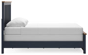 Ashley Furniture Landocken bedroom set with a bed, nightstands, and dressers shown in a modern bedroom scene.