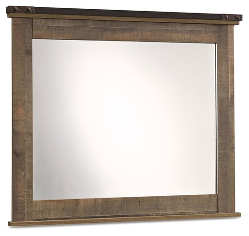 Ashley Furniture Trinell bedroom mirror hanging on a wall with a sleek wooden frame, reflecting a modern bedroom decor.