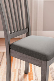 Ashley Furniture Shullden dining room set with a dark wood table and six matching chairs, detailed view of the elegant dining furniture.