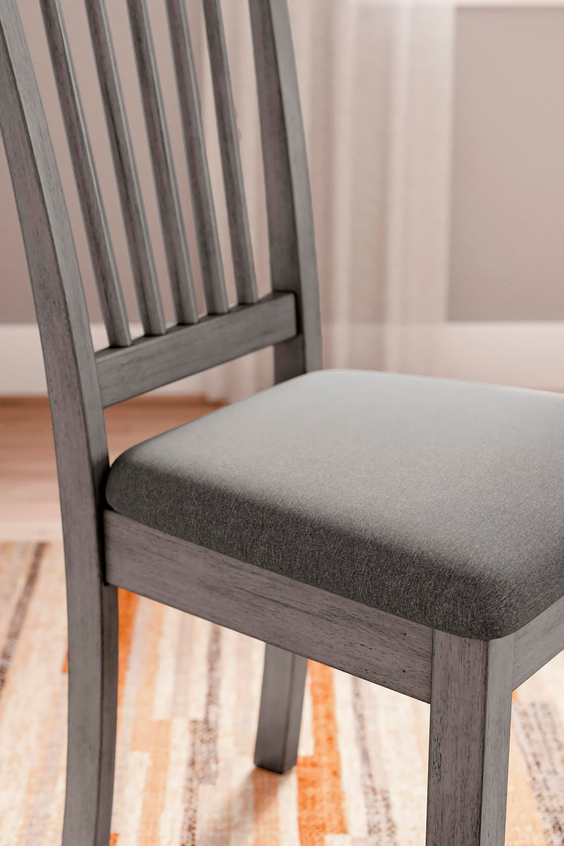 Ashley Furniture Shullden dining room set with a dark wood table and six matching chairs, detailed view of the elegant dining furniture.