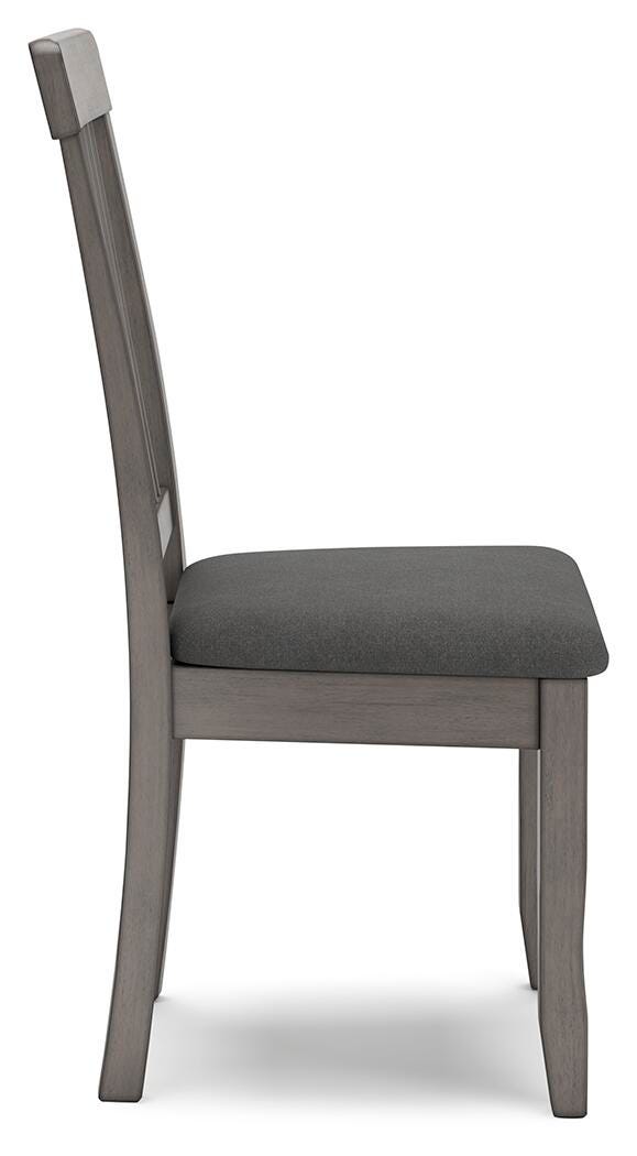 Ashley Furniture Shullden dining room set with rectangular table and six upholstered chairs, shown from a side angle.