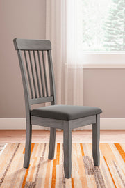 Ashley Furniture Shullden dining room set with a wooden table and six upholstered chairs, modern design for dining areas.