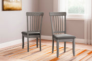 Ashley Furniture Shullden dining room set featuring a wooden table and matching chairs in a modern dining space.