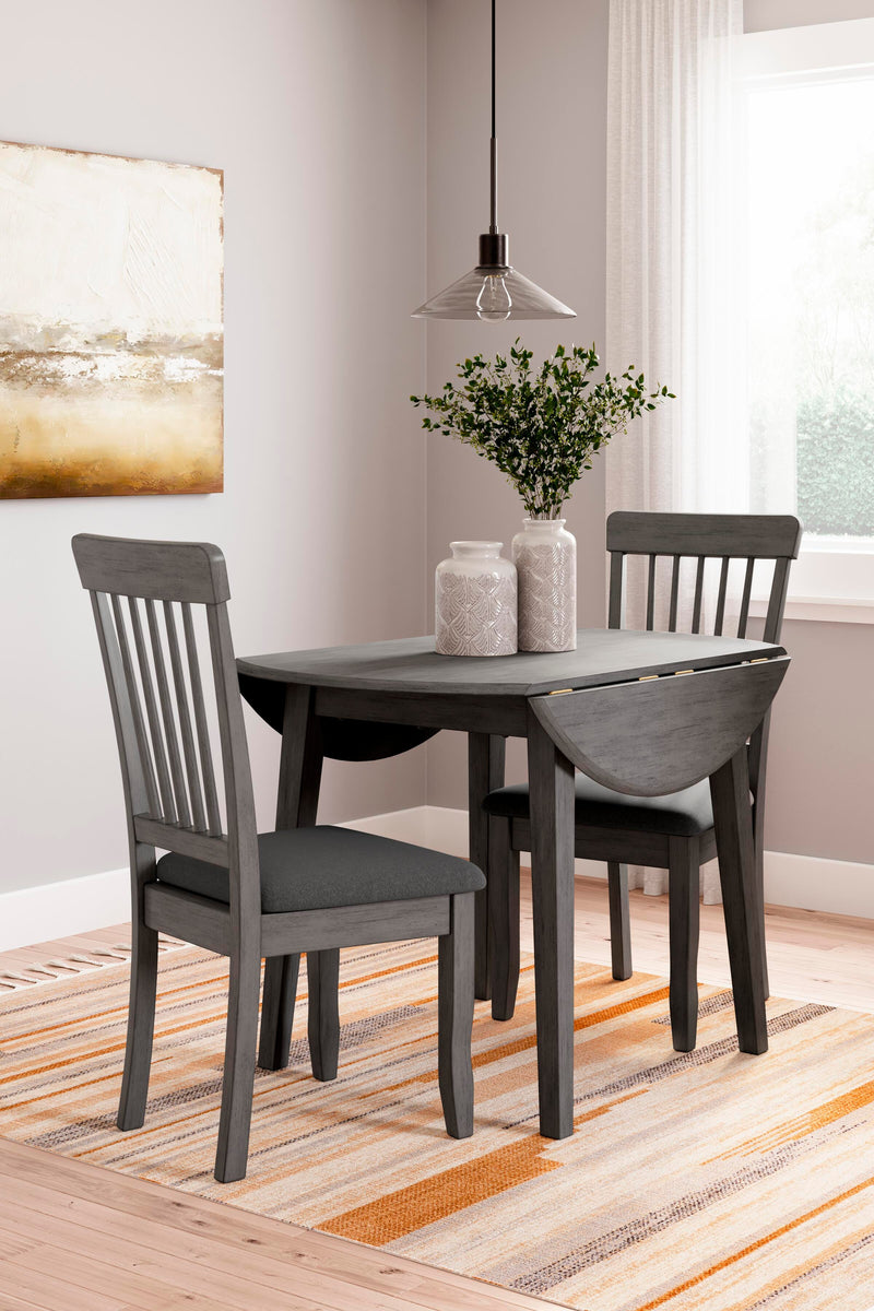 Ashley Furniture Shullden dining room set with a wooden table and matching chairs, shown in a modern dining space.