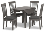 Ashley Furniture Shullden dining room set with a wooden table and six matching chairs in a cozy dining space.