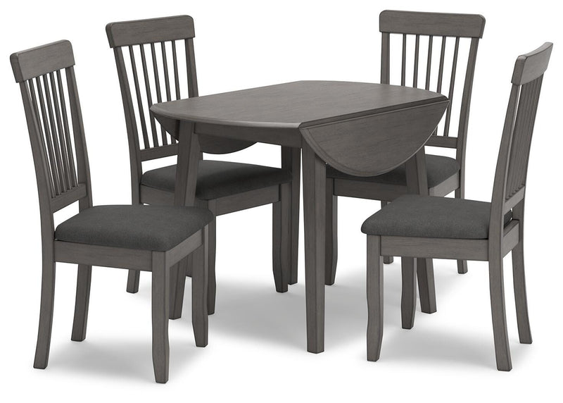 Ashley Furniture Shullden dining room set with a wooden table and six matching chairs in a cozy dining space.