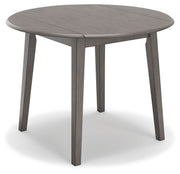 Ashley Furniture Shullden dining room set with a rectangular table and six upholstered chairs, shown from an angled perspective.