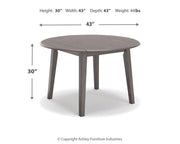 Ashley Furniture Shullden dining room set with a wooden table and six upholstered chairs in a modern dining space.