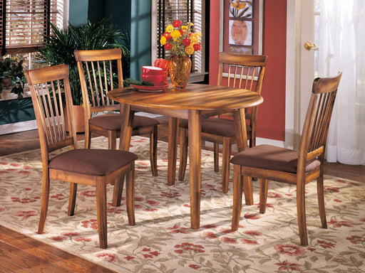 Ashley Furniture Berringer dining set with a wooden table and matching chairs in a modern dining room setting.
