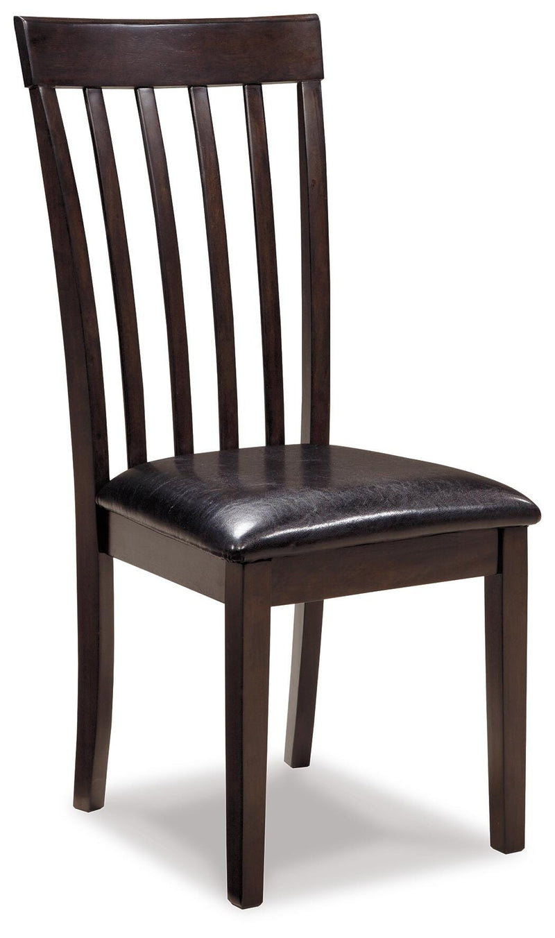 Ashley Furniture Hammis Dining Chair Set featuring four upholstered brown chairs with wooden legs on a sleek dining table.