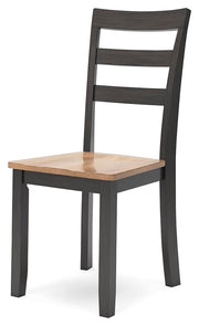 Ashley Furniture Gesthaven dining room set with a wooden table and six matching chairs, viewed at an angle.