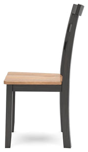 Ashley Furniture Gesthaven dining set featuring a wooden table and matching chairs, ideal for a stylish dining room.