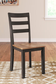 Ashley Furniture Gesthaven Dining Set with round table and six upholstered chairs in a classic dining room style.
