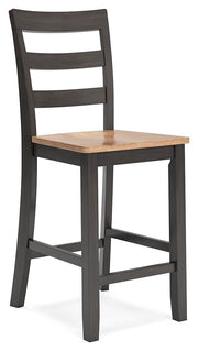 Ashley Furniture Gesthaven dining room set with a wooden table and six upholstered chairs, shown from an angled perspective.