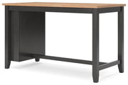 Ashley Furniture Gesthaven dining room set with a wooden table and six upholstered chairs, shown from an angled side view.